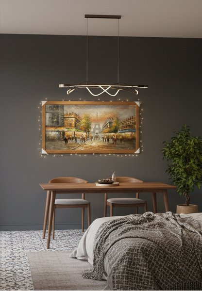 Dining area with a table, chairs, and a painting on a gray wall.