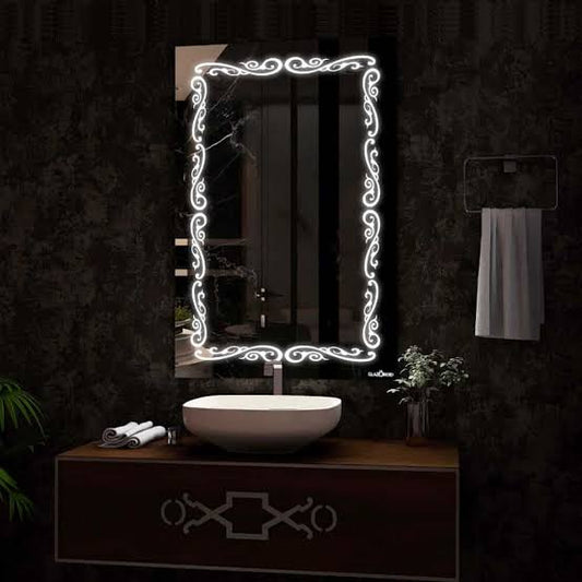 Bathroom vanity with illuminated decorative mirror on a dark wall.
